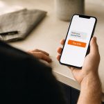 Customer looking at a payment link on their phone with a Pay £40 button